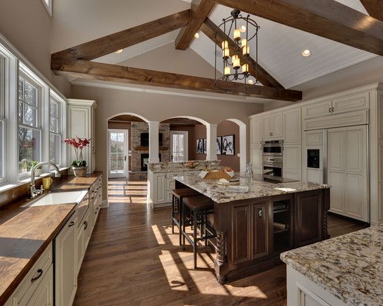 beautiful two-tone kitchen with vaulted ceiling beams, wood floors beautiful two-tone kitchen with vaulted ceiling beams, wood floors