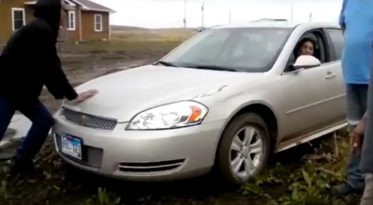 Women with car ford stuck in the mud Car ford, Stuck in