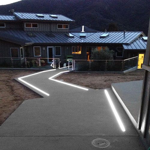 in ground extrusions light up this concrete pathway are led light strips waterproof
