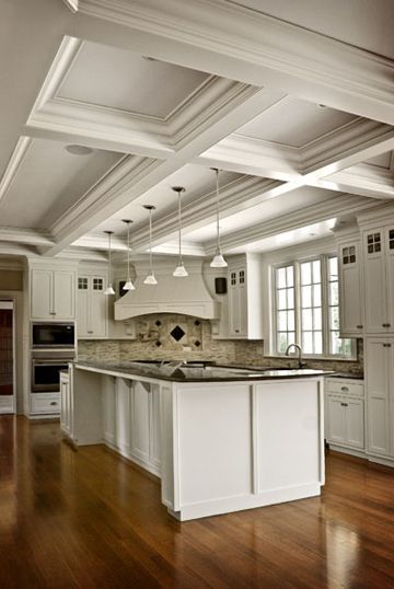 Elegant medium tone wood floor kitchen/dining room combo photo in Charleston with white walls Elegant medium tone wood floor kitchen/dining room combo photo in Charleston with white walls