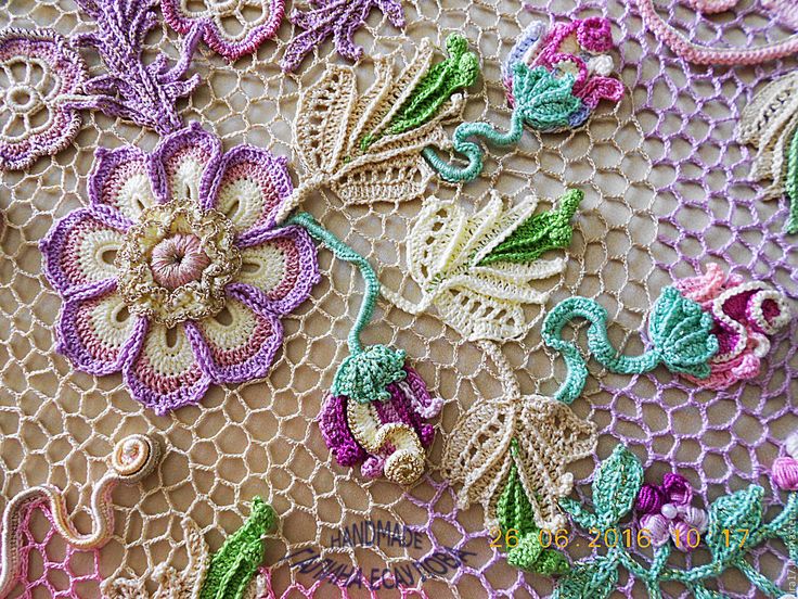 Close up: Irish crochet lace features three-dimensional flowers and tangled garl