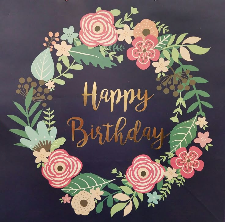 a happy birthday card with flowers and leaves in the center on a black background that says, happy birthday