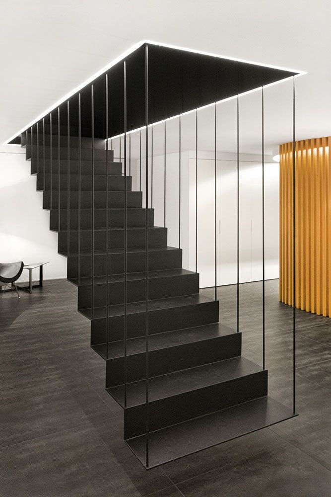 the stairs are made of glass and wood