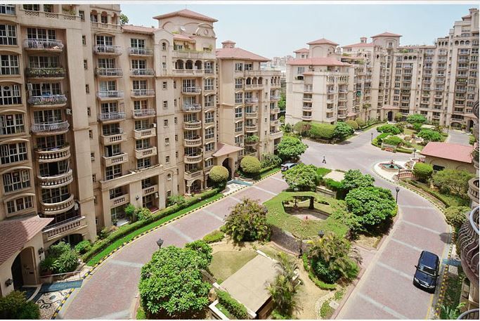 This may contain: an aerial view of several apartment buildings in the city
