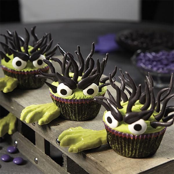 mold the candy hand details for this halloween cupcake using the wilton zombie hand candy mold