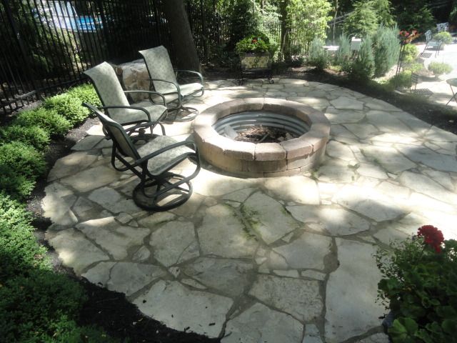 tumbled paver fire pit blends in great with this flagstone patio in brighton michigan design - Flagstone Patio Designs tumbled paver fire pit blends in great with this flagstone patio in brighton michigan design - Flagstone Patio Designs