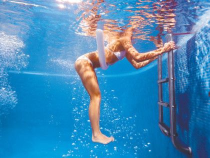 3. Hip extensions Why? These work your glutes and hamstrings. How? Hold onto the pool edge or ladder, elbows bent. Place a pool noodle under your bellybutton to help you keep your hips close to the water's surface. Start with your hips slightly below the surface of the water and legs straight and vertical. pull through your glutes and hamstrings and lift your legs back until they are close to the surface. Lower, using your hip flexors, back to vertical. Sets and reps: 3 sets of 8-15.