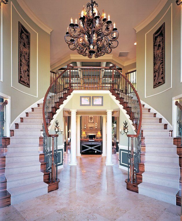 Split staircase foyer | Foyer decorating, Curved staircase, Staircase