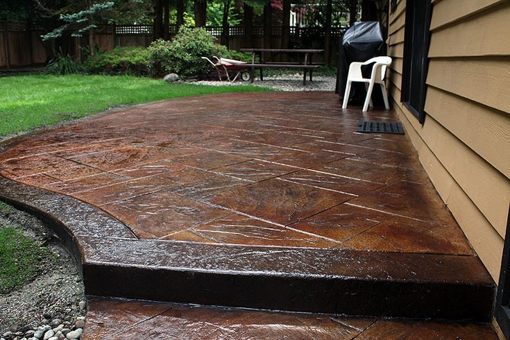 Add Visual Impact With The Right Stamped Concrete Contractor In Winnipeg Stain Patio Designs Outdoor Concrete Stain Patio, How To Paint Your Stamped Concrete Patio