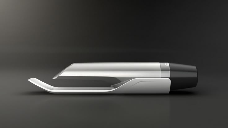 an electronic device is shown on a dark surface with light coming from