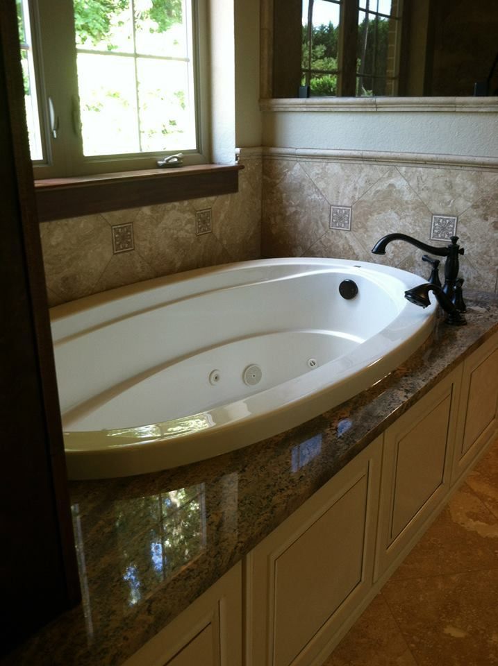 granite around a bathtub. knoxville's stone interiors. showroom
