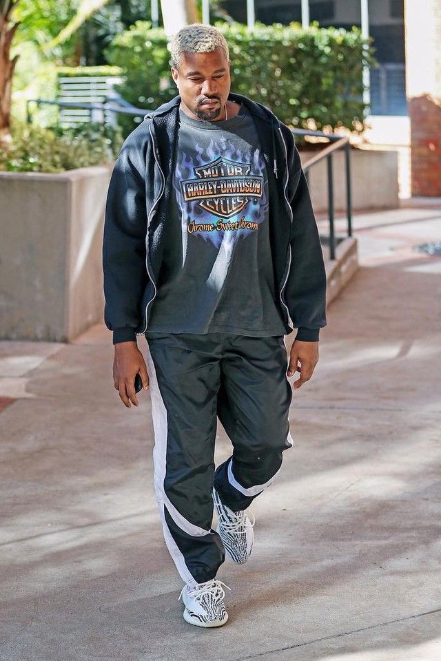 Kanye West wearing Reebok Track Pants, Vintage 1990s Chrome Sweet Chrome T-Shirt,