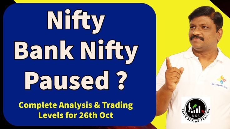 A Man In White Shirt Holding Up A Sign That Says Nifty Bank Nifty Paused a-man-in-white-shirt-holding-up-a-sign-that-says-nifty-bank-nifty-paused