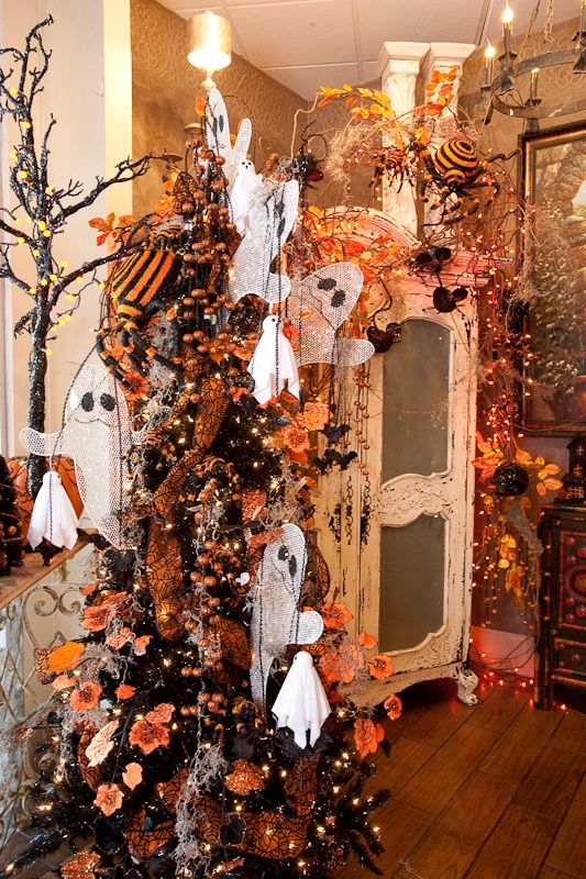 halloween decor love the ghosts in the tree but i use bare limbsbranches for spooky outside trees