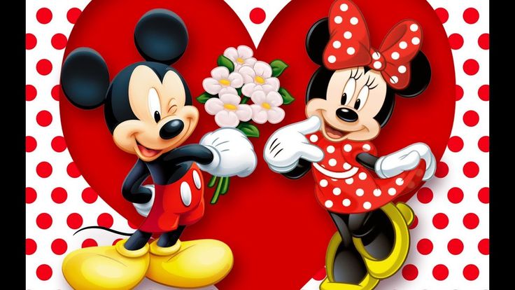 two mickey and minnie mouses with flowers in front of the heart shaped wallpaper