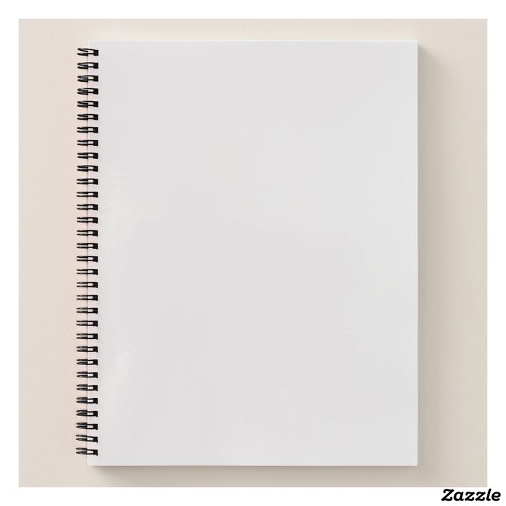 Blank white spiral notebook containing book, notebook, and white