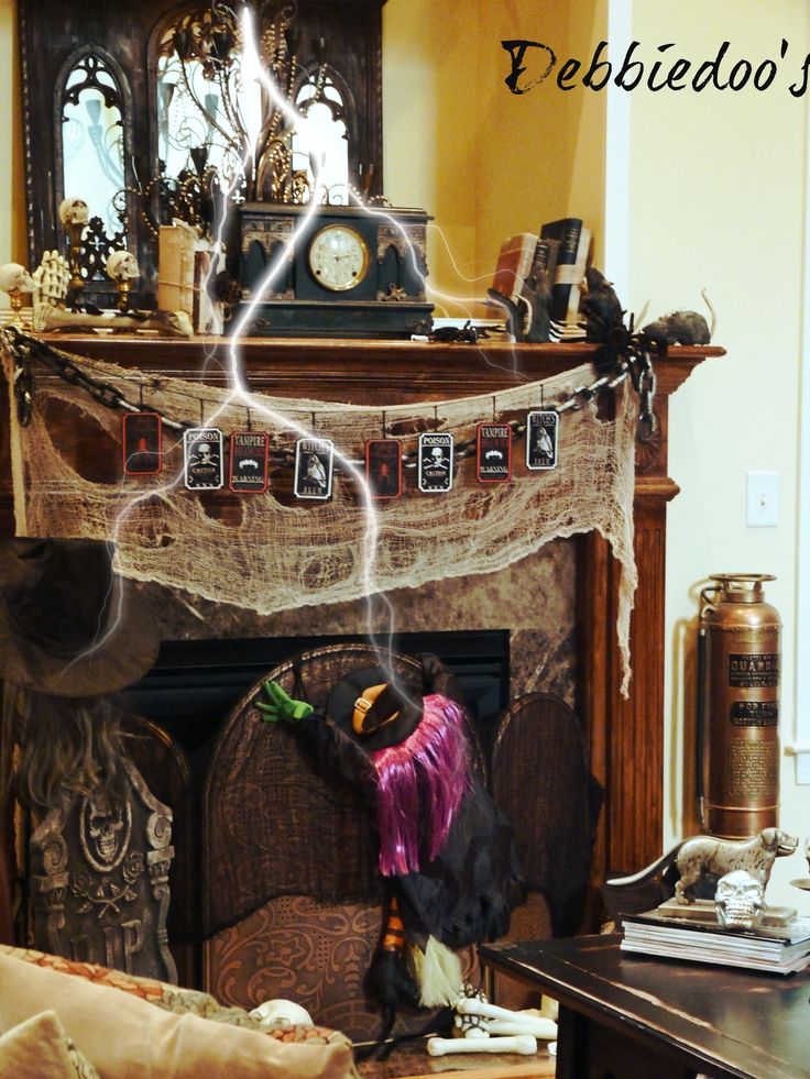 spooky gothic halloween mantel using mostly stuff from the dollar tree