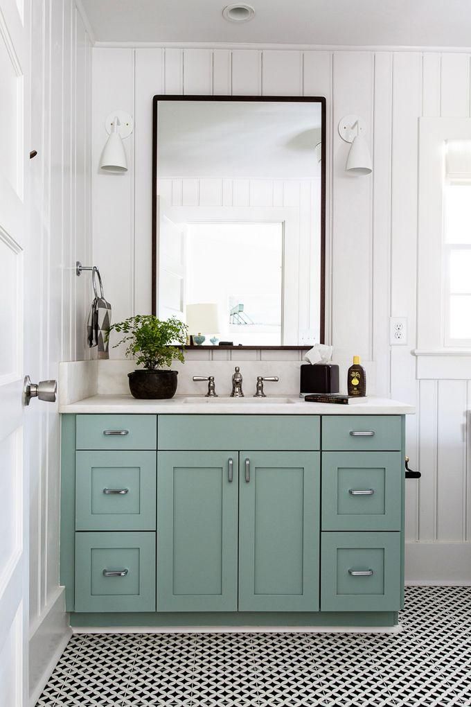 the bathroom is decorated in shades of blue and white