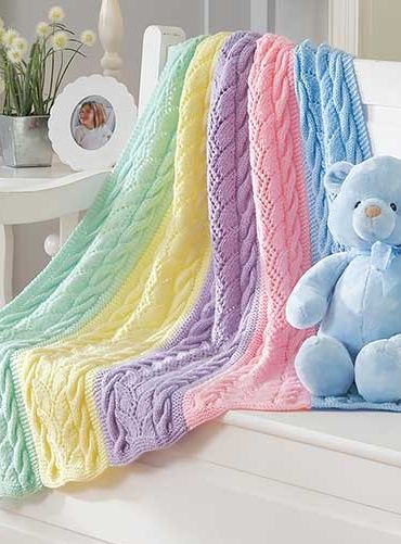 Knitting Pattern for Striped Cables Baby Blanket - #ad Cable and lace rainbow blanket knit in sections and seamed. One of 9 patterns in Dreamy Baby Wraps | See more pics at LeisureArts.com