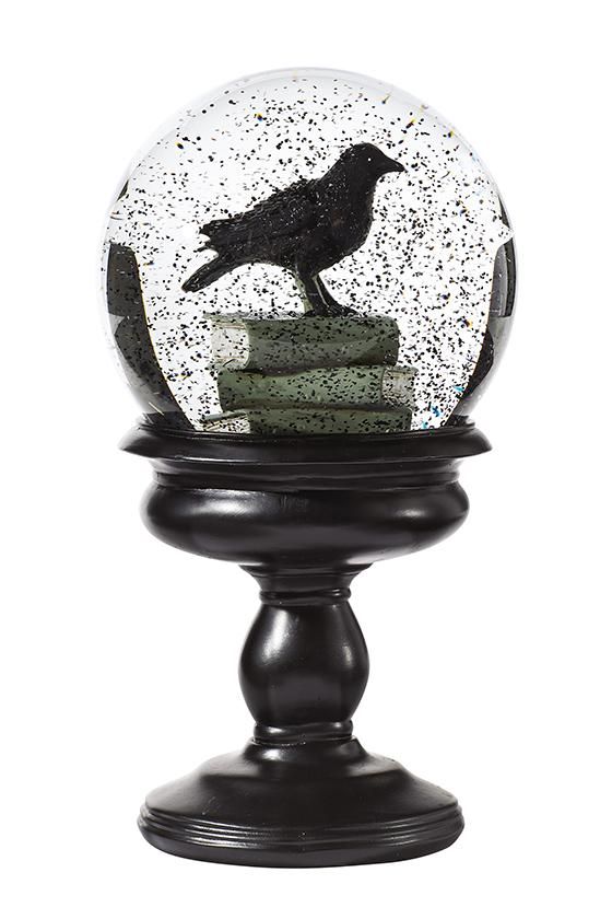the magic of snowglobes gets bewitched with this piece of tabletop halloween decor simply