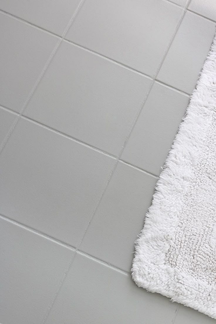 Ugly ceramic floor tile painted with gray floor & patio paint - LOVE how it turn...