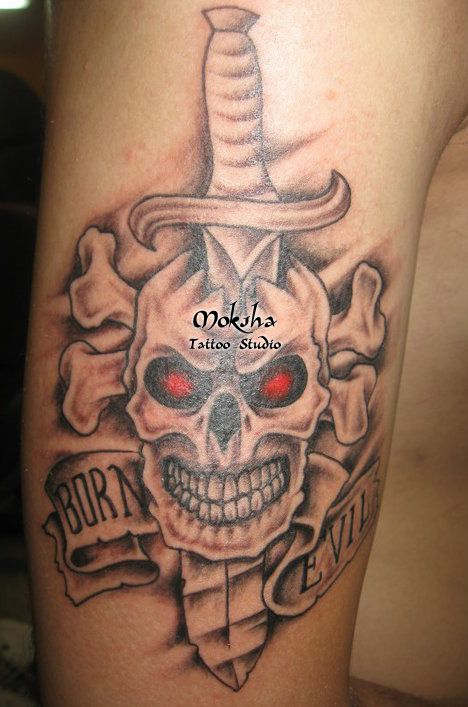 red eyes skull and dagger tattoo on bicep tattoos red eyes skull and dagger tattoo on bicep tattoos
