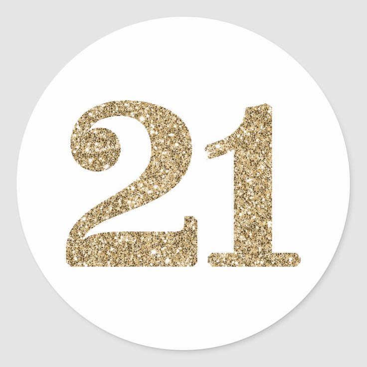 the number twenty one in gold glitter on a white round sticker that says,'21