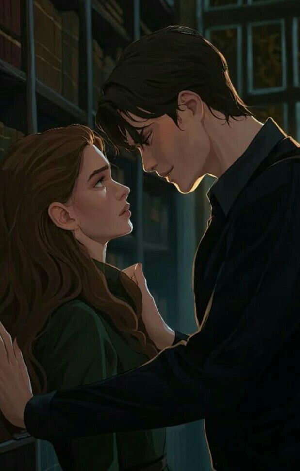 This may contain: a man and woman standing next to each other in front of a bookshelf