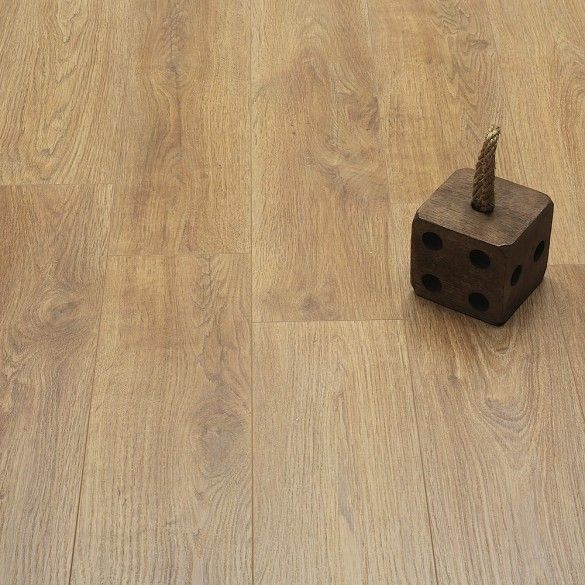 a wooden block with a toy on top of it sitting on the floor next to a dice