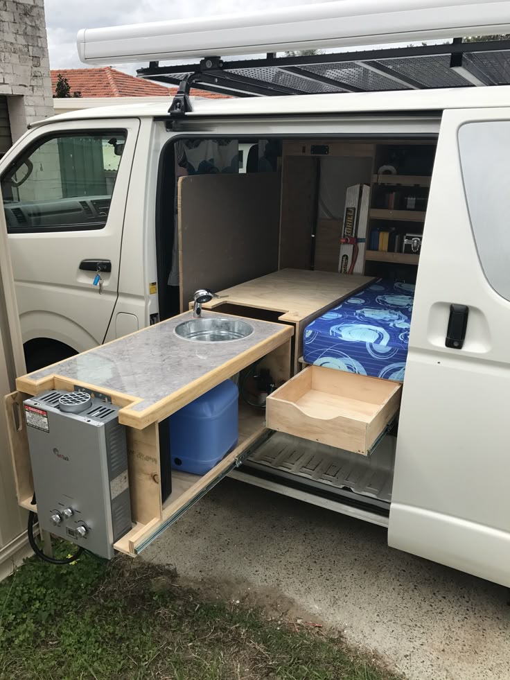 Campervan kitchen with hot water. | Minivan camping, Hiace camper, Camp