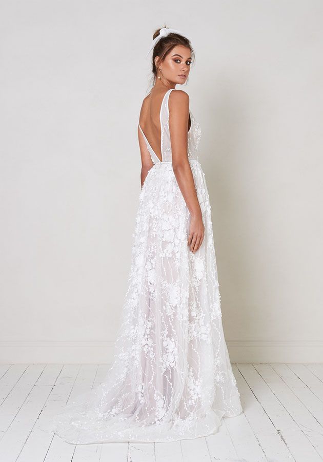 Sleeveless v-neck a-line wedding dress with three dimensional floral appliqués … Sleeveless v-neck a-line wedding dress with three dimensional floral appliqués …