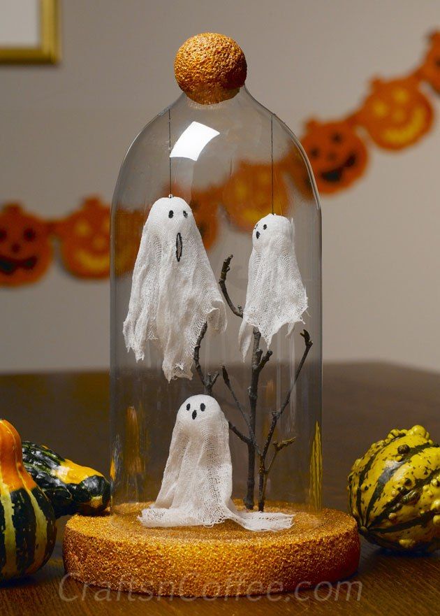 three itty bitty cheesecloth ghosts decorate this halloween cloche adorable and the cloche