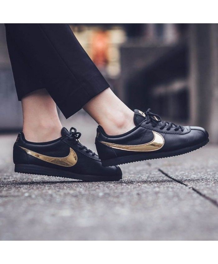 nike black and gold cortez trainers