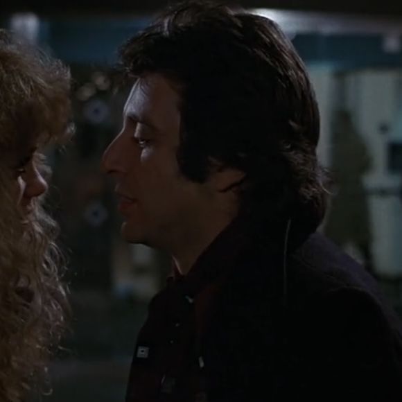 a man and woman standing next to each other