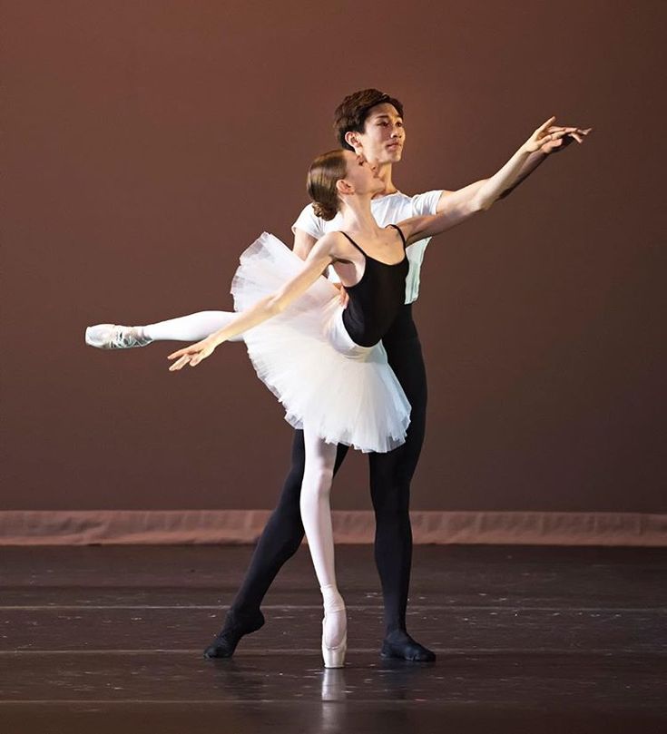 Two Ballerinas In White Tutus And Black Leotards
