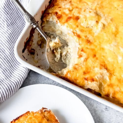 Layers of potatoes, cheese, onions, and a creamy sauce bake up into one of our f...