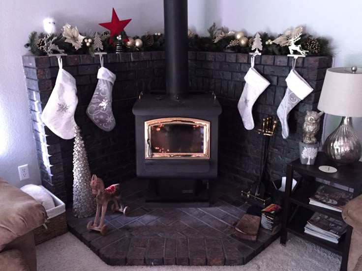 christmas decor for corner wood stove fireplace mantel pinterest christmas mantel decor