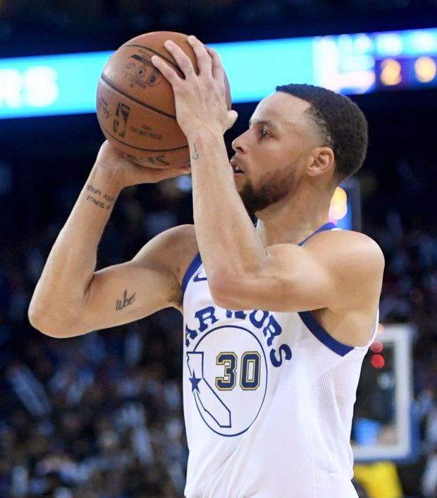 Golden State Warriors' Stephen Curry (30) makes a basket in the third period...