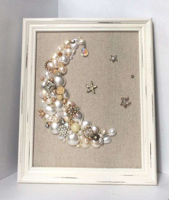 a white frame with some pearls on it