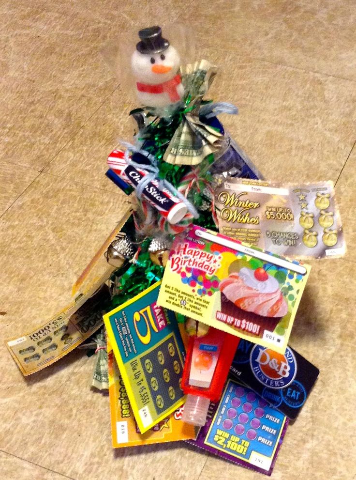 Lottery ticket and other things clipped to Christmas tree | Lottery