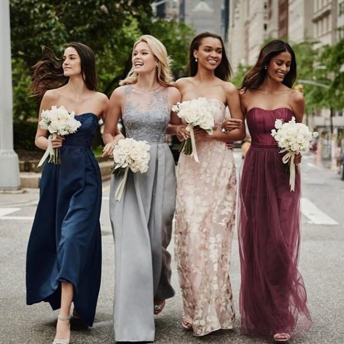 This elegant bridesmaid dress from Oleg Cassini includes some of the high-fashio...