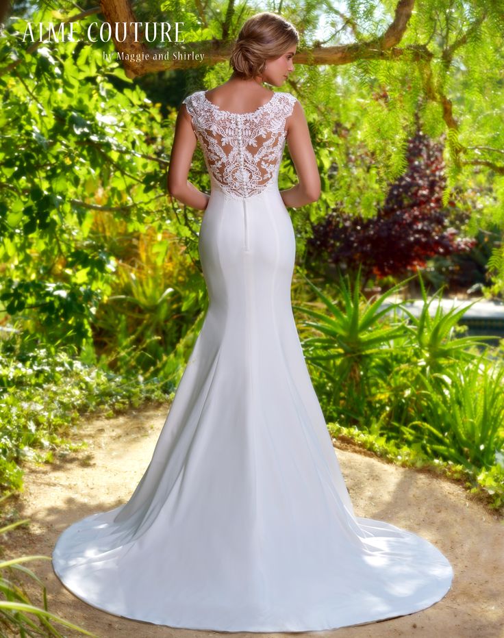 Aime Couture 193 Is A Simplistic Elegance Found In This Form Fitting Crepe Gown That Flares Into Train Dress Has Guipure Laced Back And Capped Aime Couture 193 Is A Simplistic Elegance Found In This Form Fitting Crepe Gown That Flares Into Train Dress Has Guipure Laced Back And Capped