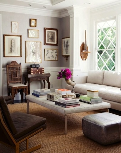 Art on wall looks like they are all pencil drawings. | Home living room