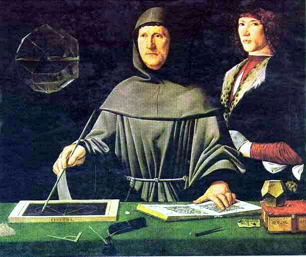 two people standing next to each other in front of a table with an open