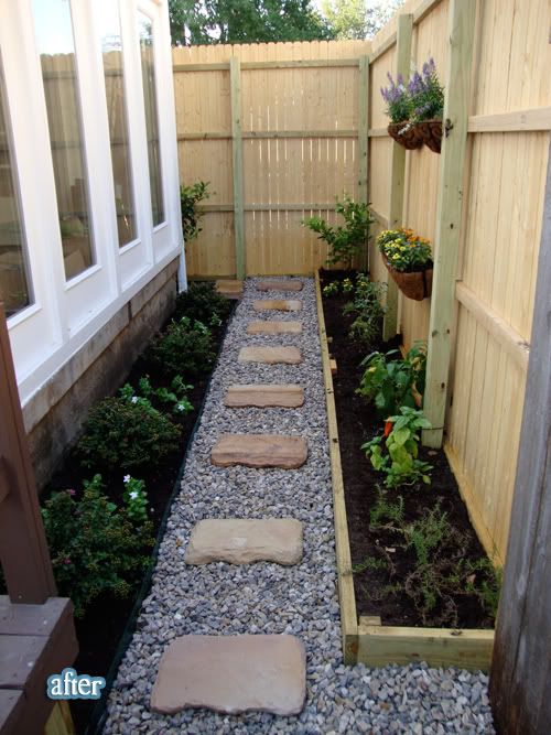 a small garden area with gravel and rocks