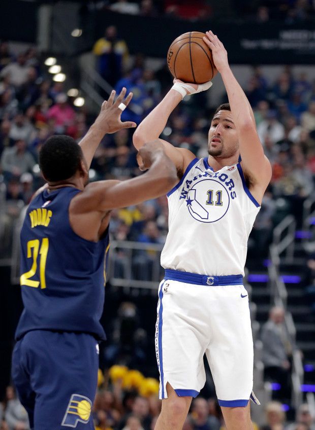 Golden State Warriors guard Klay Thompson (11) shoots over Indiana Pacers forwar...