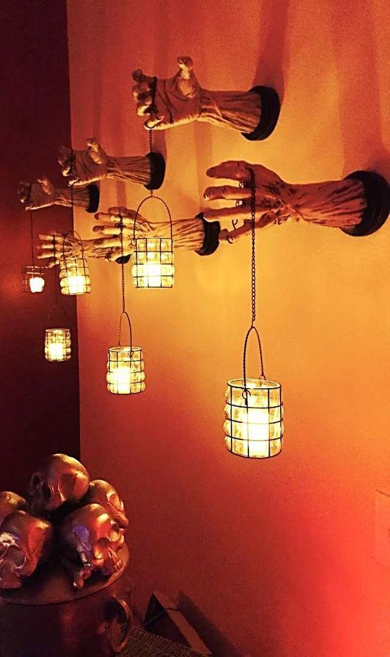 Sconce lamps, monster hands coming out of walls. See more spooky Halloween lamps...