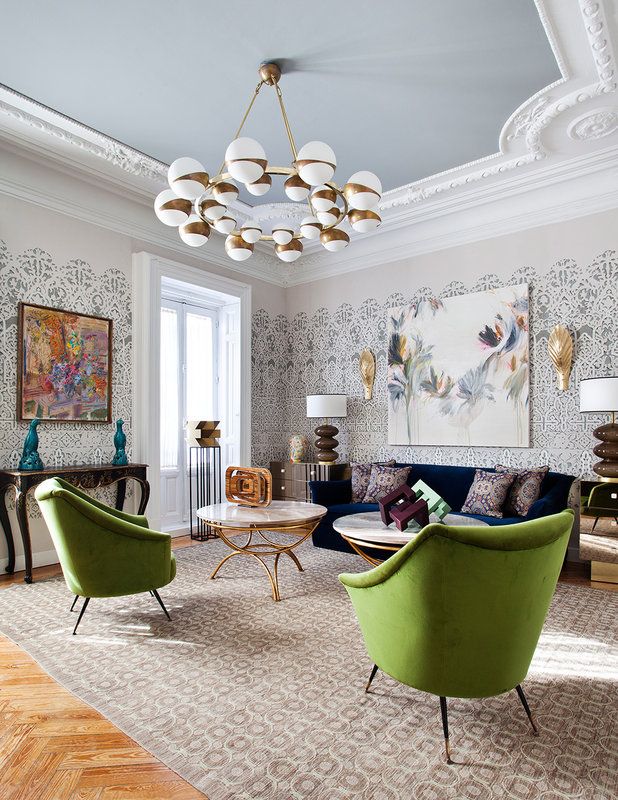 a living room filled with furniture and a chandelier