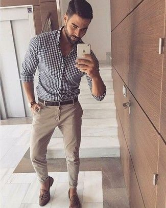 A white and black gingham button-down shirt and beige chinos is a versatile comb… A white and black gingham button-down shirt and beige chinos is a versatile comb…
