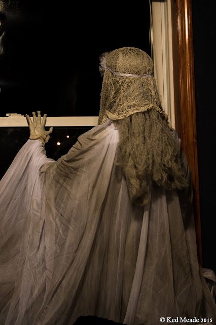 ghost in the window used in an upstairs room with awesome back lighting creepy halloween decorationshalloween